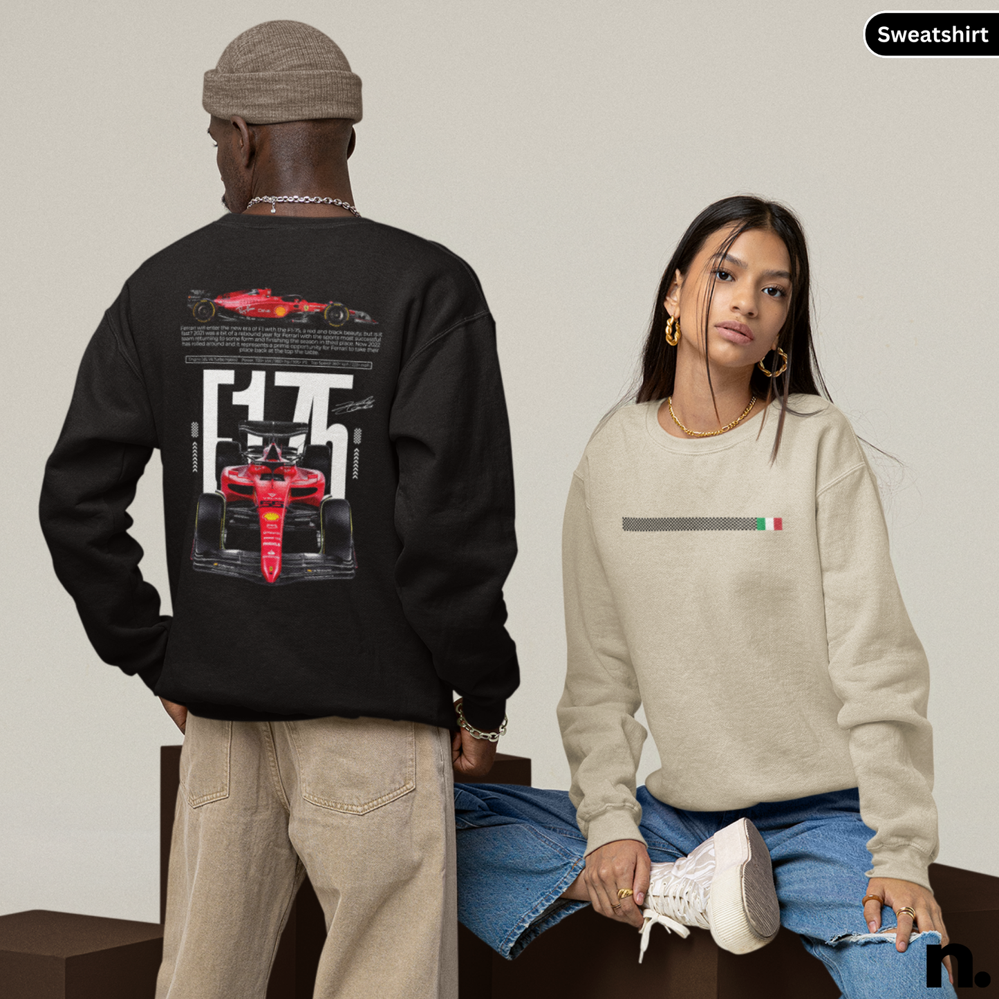 Two people wearing sweatshirts with racing car designs on a neutral background