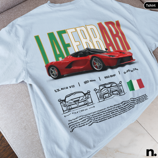 White t-shirt with red Ferrari design and text on a wooden surface