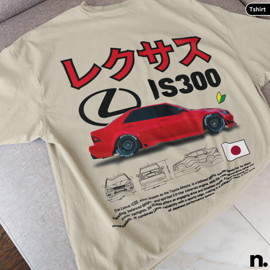Beige t-shirt with red Lexus IS300 graphic and Japanese text on a wooden surface.