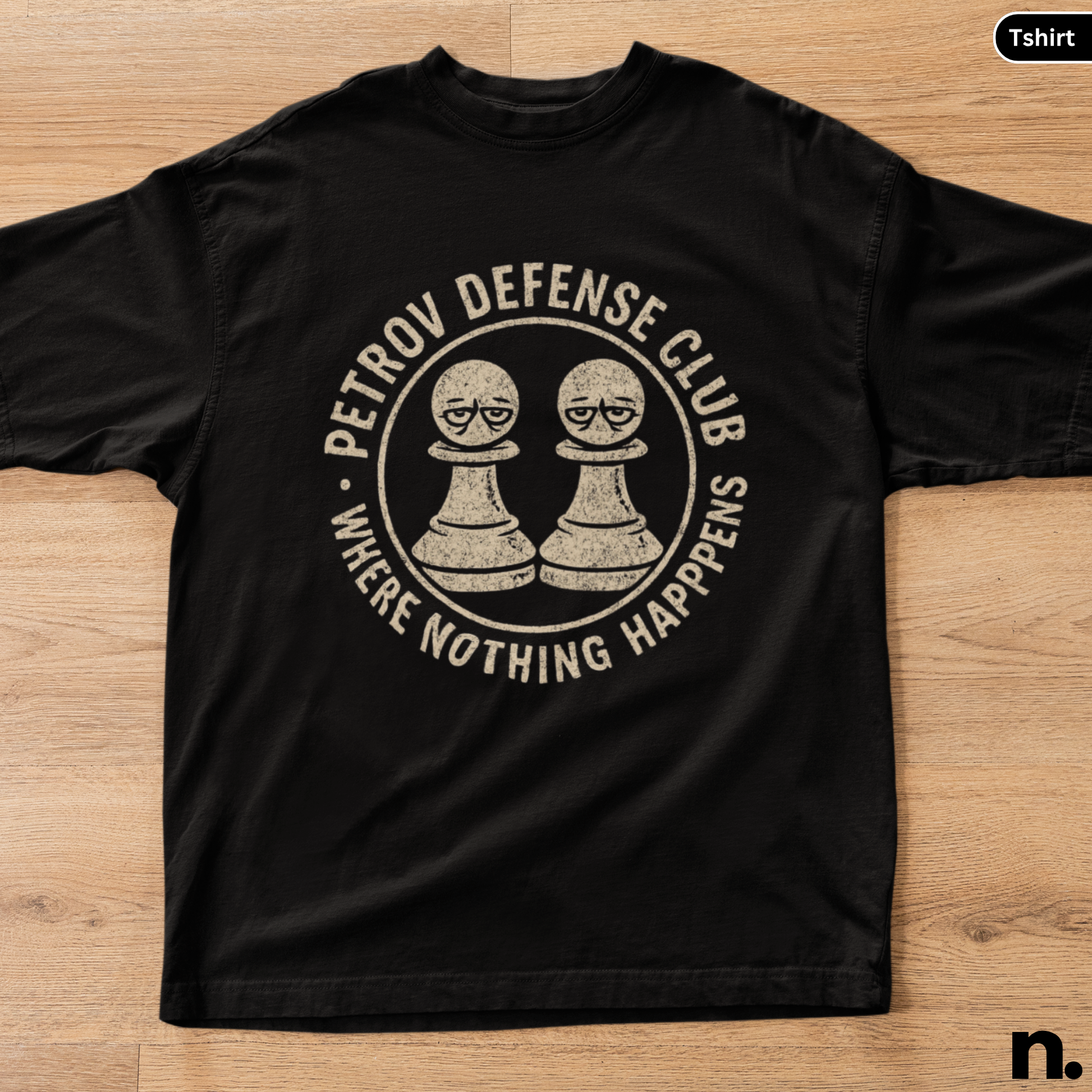 Black t-shirt with 'Petrov Defense Club' graphic on a wooden surface
