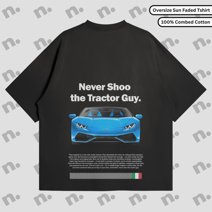 Vintage sun-faded tee featuring the “Never Shoo The Tractor Guy” design — a nod to Lamborghini’s rebellious origin story