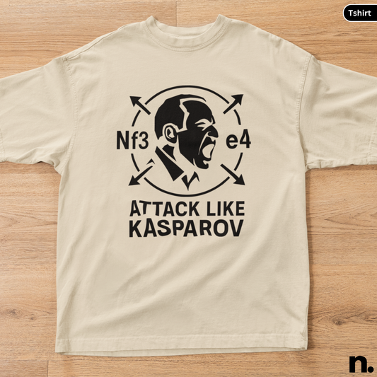 Beige t-shirt with black graphic and text on a wooden surface