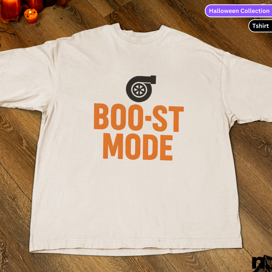 White t-shirt with 'BOO-ST MODE' text and turbo graphic on a wooden surface.