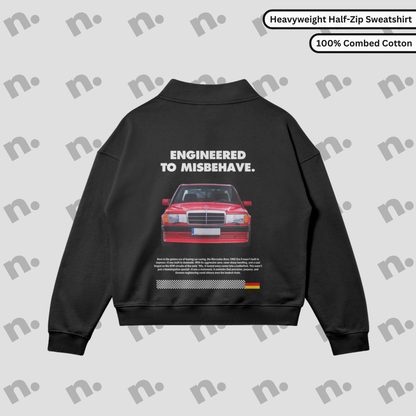 Flat lay of a half-zip stand collar sweatshirt featuring a clean 190E Evo II inspired design, paired with motorsport-style accessories on a minimal, neutral background.