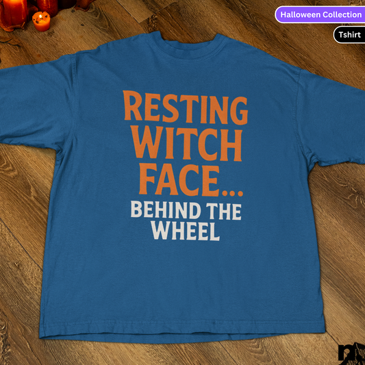 Blue t-shirt with orange and white text on a wooden surface