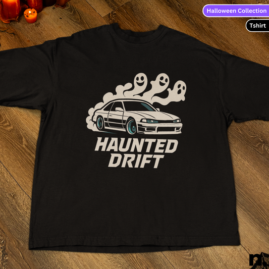 Black t-shirt with 'Haunted Drift' graphic design on a wooden surface