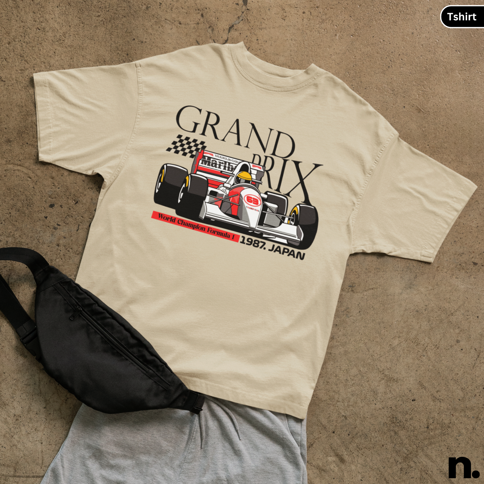 flat lay mockup of grand prix japan tshirt in sand