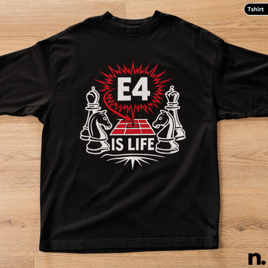 Black t-shirt with chess piece design and 'E4 IS LIFE' text on a wooden surface