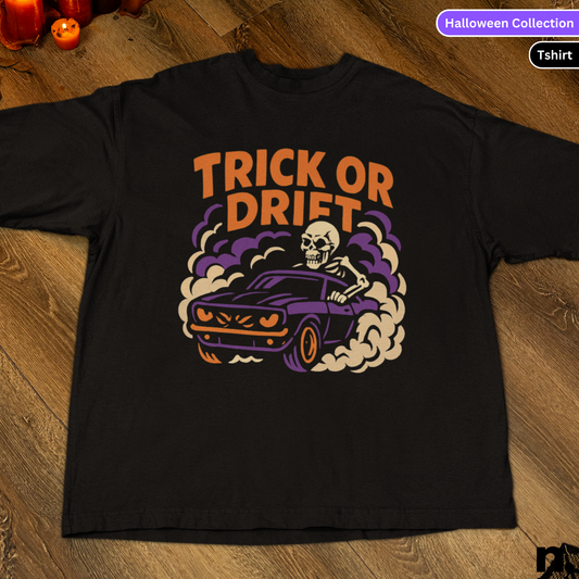 Black t-shirt with 'Trick or Drift' graphic design on a wooden surface