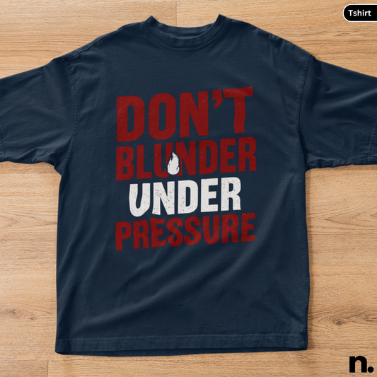 Navy blue t-shirt with red and white text on a wooden surface