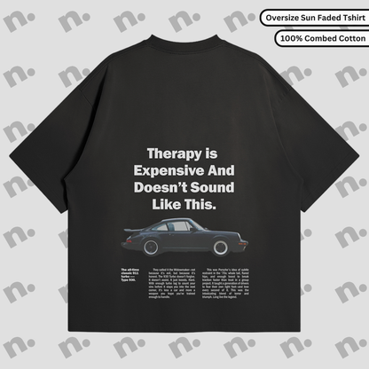Flat lay of the 911 Therapy Sun Faded T-shirt featuring a classic 911 graphic and 'Therapy is Expensive' slogan.