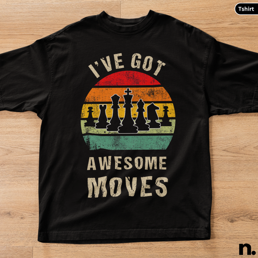 Black t-shirt with chess design and 'I've got awesome moves' text on a wooden surface