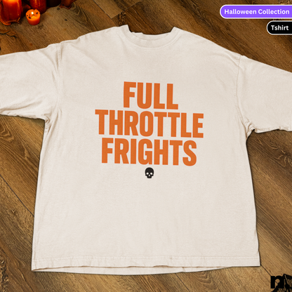 White t-shirt with 'FULL THROTTLE FRIGHTS' text in orange on a wooden surface.