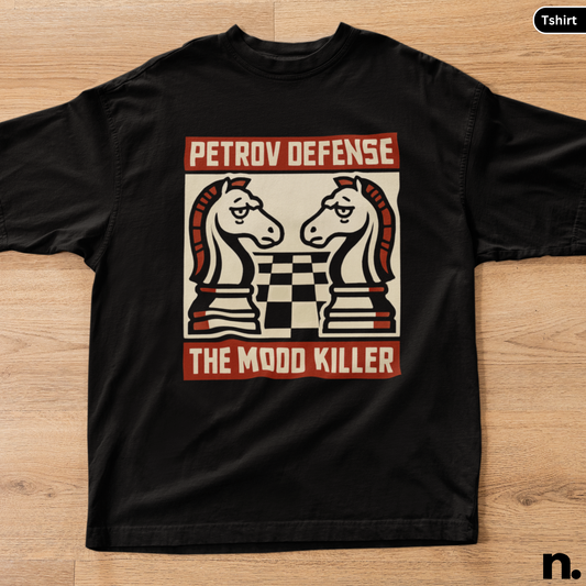 Black t-shirt with chess piece design and text on a wooden surface