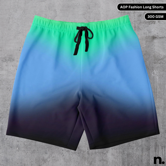 A flat lay of men's long shorts with a unique, seamless colour diffusion pattern, showcasing the drawstring closure and pockets.