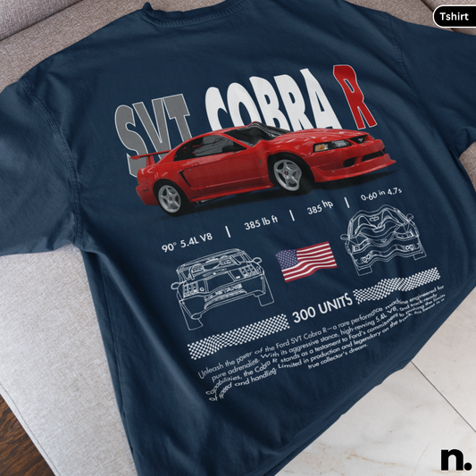 Navy blue t-shirt with red car graphic and text on a gray surface