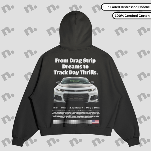 Flat lay of heavyweight hoodie with washed gradient and distressed edges, inspired by vintage speed and garage-worn aesthetics.