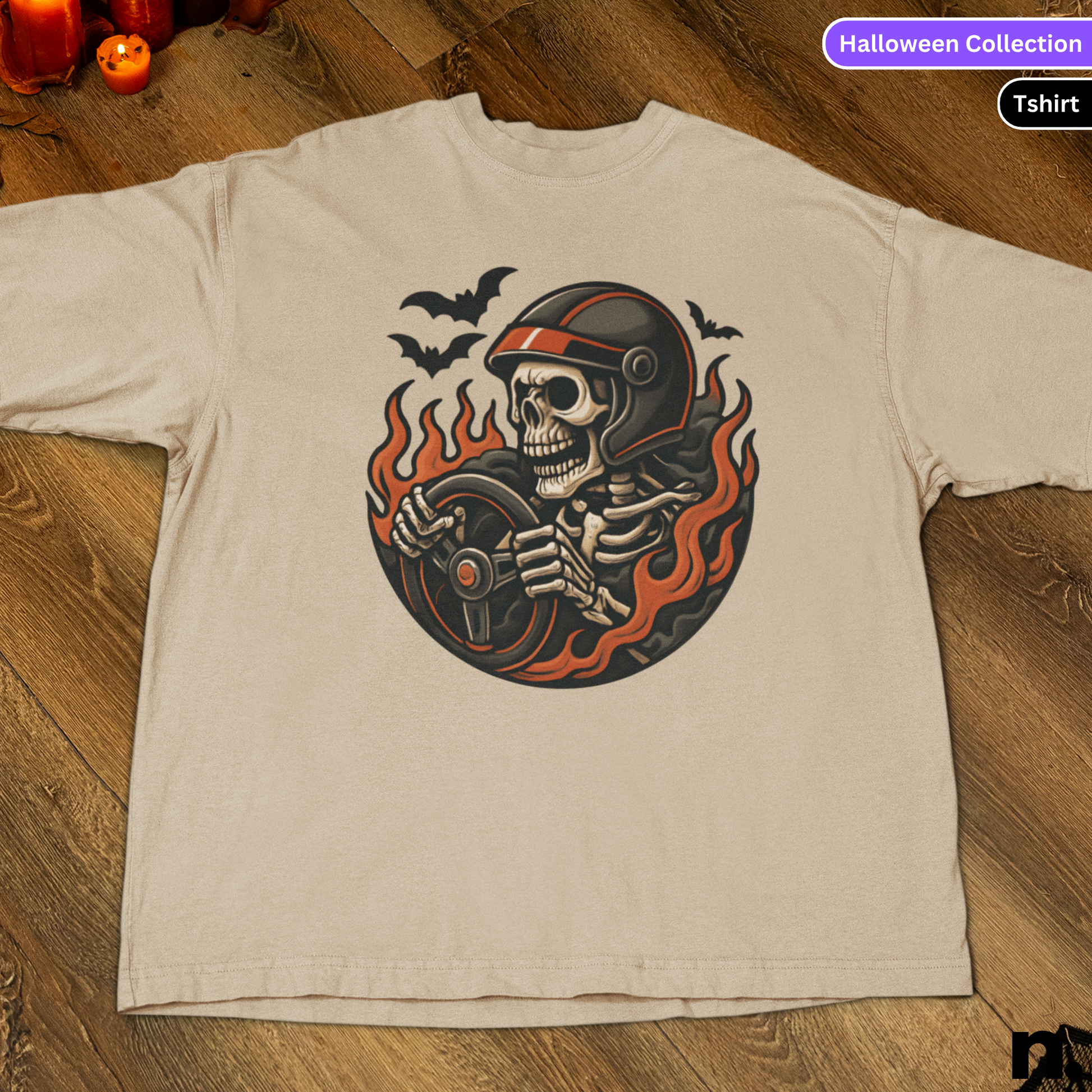 Beige t-shirt with a skeleton design on a wooden surface, labeled 'Halloween Collection'.
