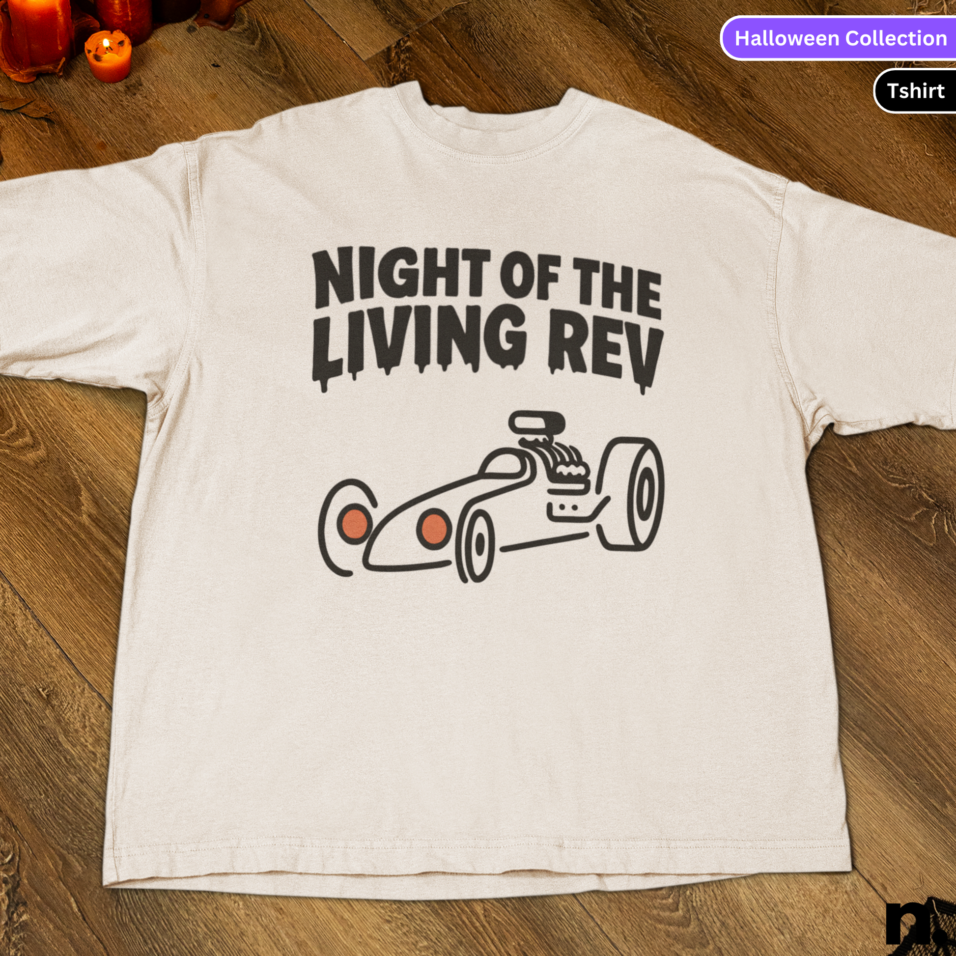 White t-shirt with 'Night of the Living Rev' graphic on a wooden surface