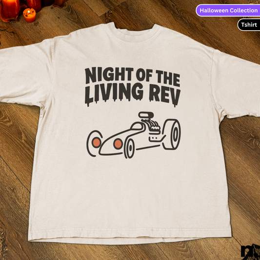 White t-shirt with 'Night of the Living Rev' graphic on a wooden surface