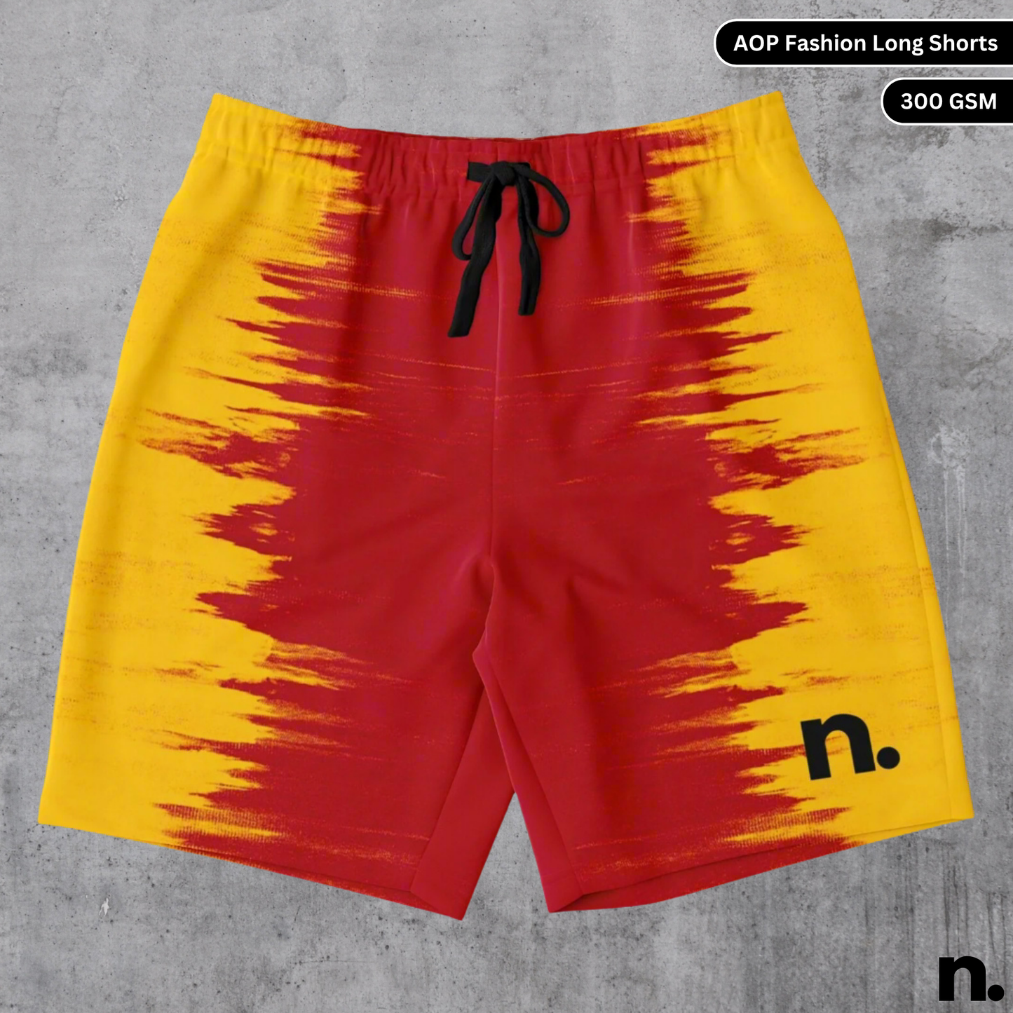 A flat lay of shorts featuring a vivid all-over yellow and red color diffusion pattern, showcasing the drawstring closure and pockets.