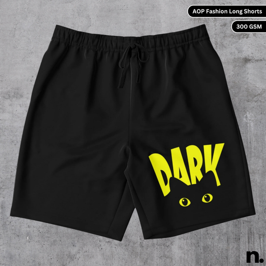 Flat lay of long shorts featuring a black cat graphic and bold "DARK" text in a mysterious streetwear design