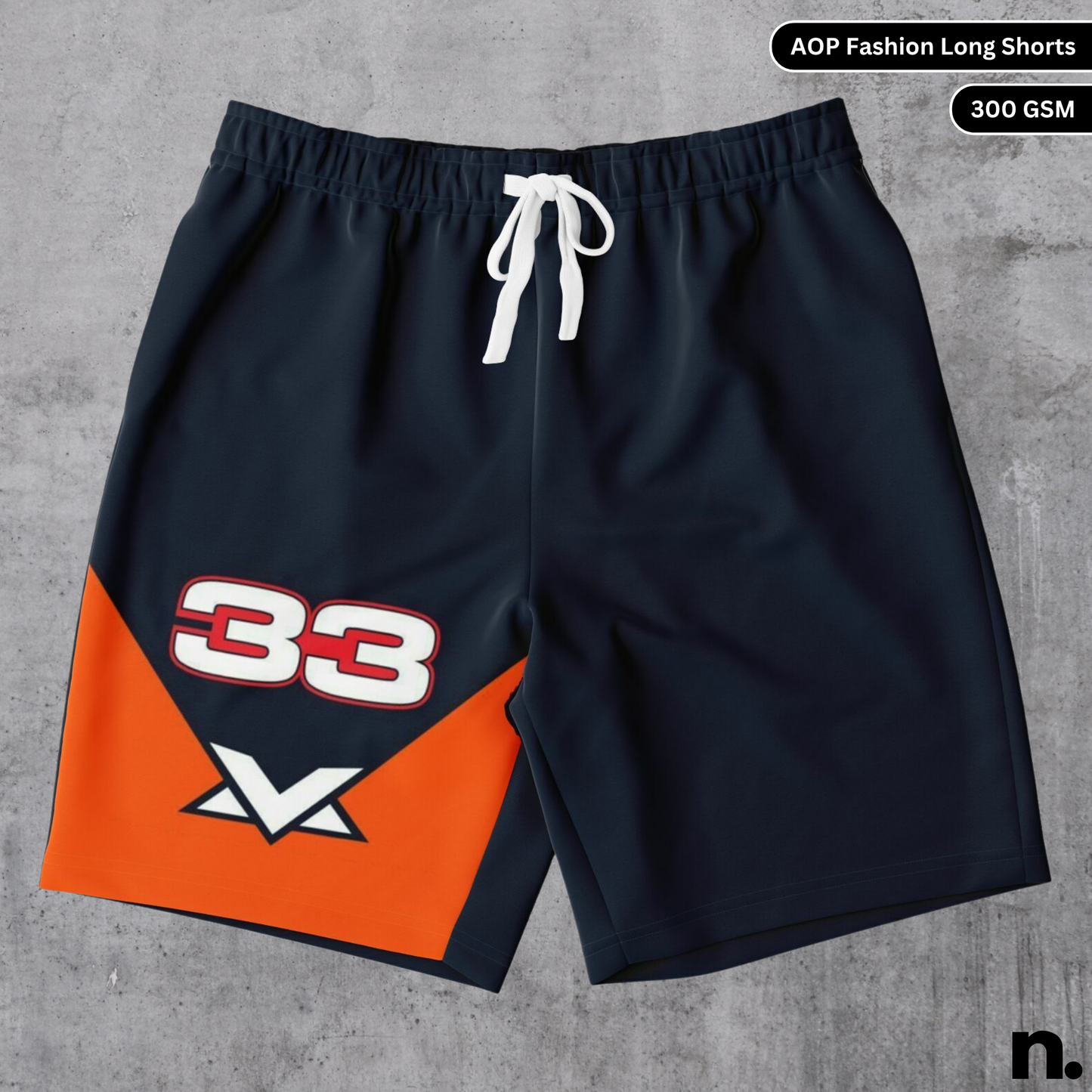A flat lay of men's long shorts with an all-over print design inspired by F1 driver Max Verstappen, showcasing the drawstring closure and pockets.