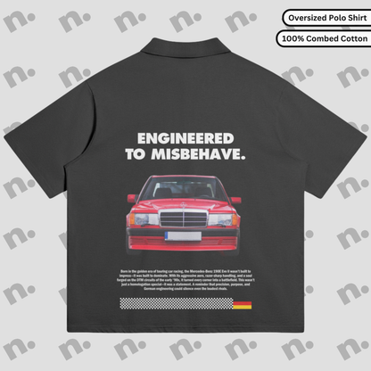Flat lay of an oversized polo shirt featuring a subtle 190E Evo II inspired design, styled with motorsport and streetwear accessories on a neutral background.
