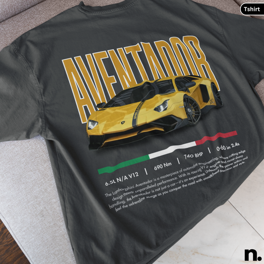 Black t-shirt with yellow Lambo Aventador graphic and text on a gray surface.