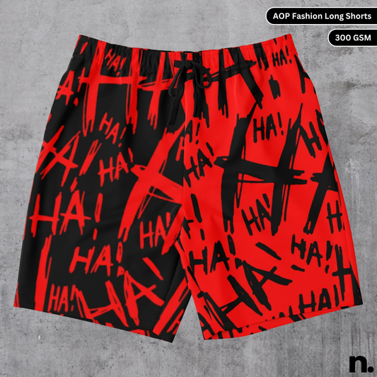 A flat lay of men's long shorts with an all-over print featuring Joker-inspired artwork, showcasing the drawstring closure and pockets.