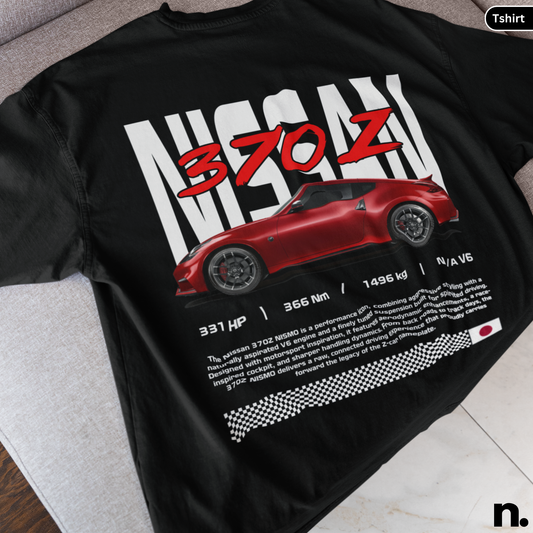 Black t-shirt with a red Nissan 370Z graphic and technical specifications on a gray surface.