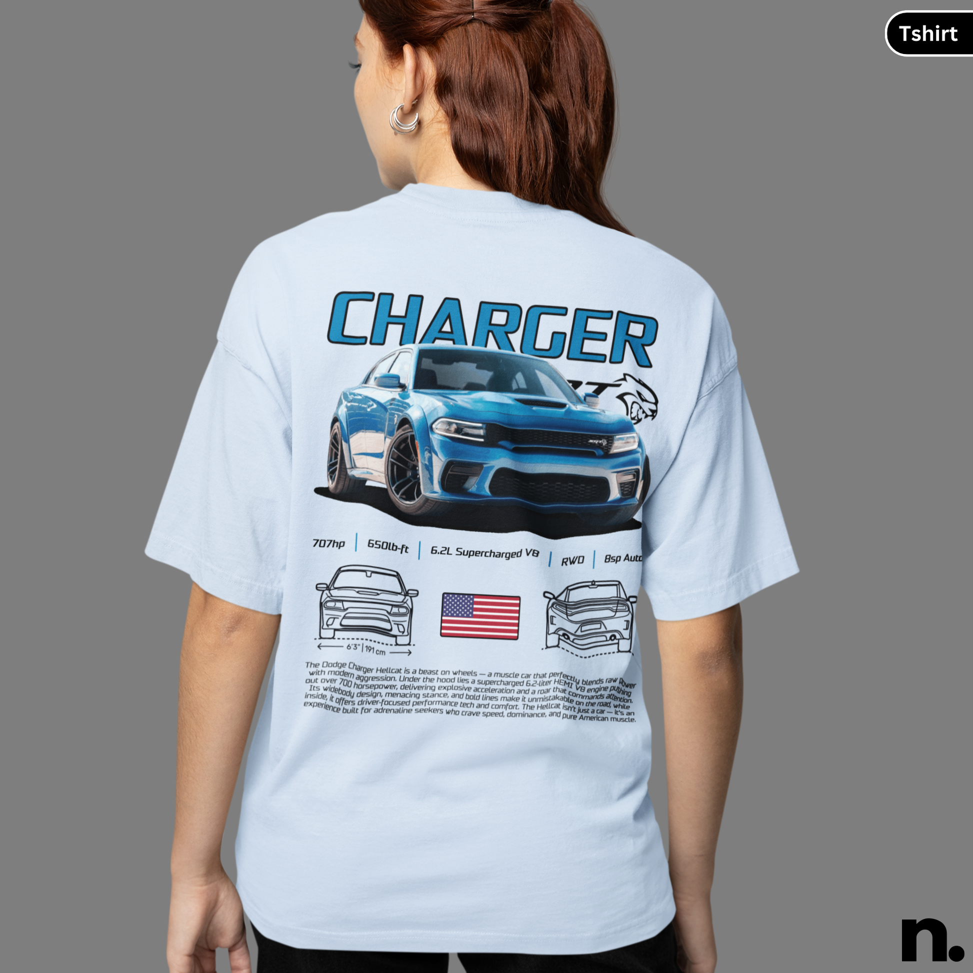Person wearing a light blue t-shirt with a 'Charger' graphic on the back