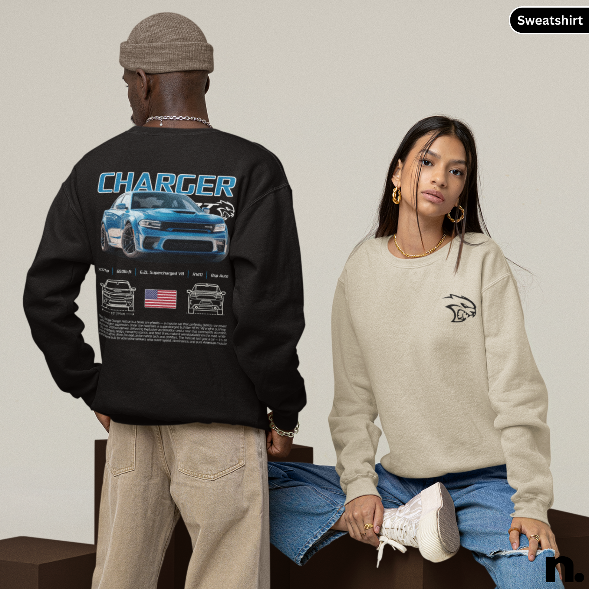 Two people wearing sweatshirts, one black with 'Charger' design, the other beige with logo.