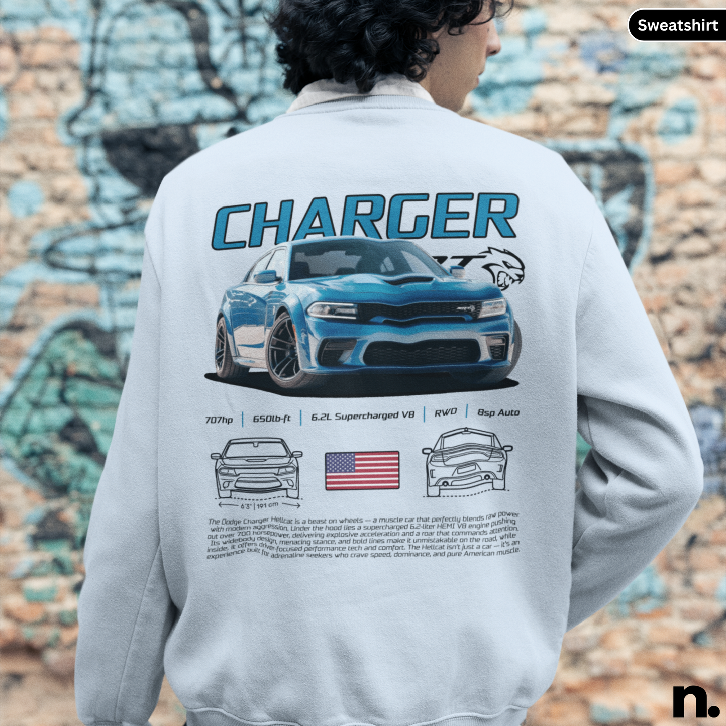 Person wearing a sweatshirt with a 'Charger' design on the back, featuring a car illustration and text.