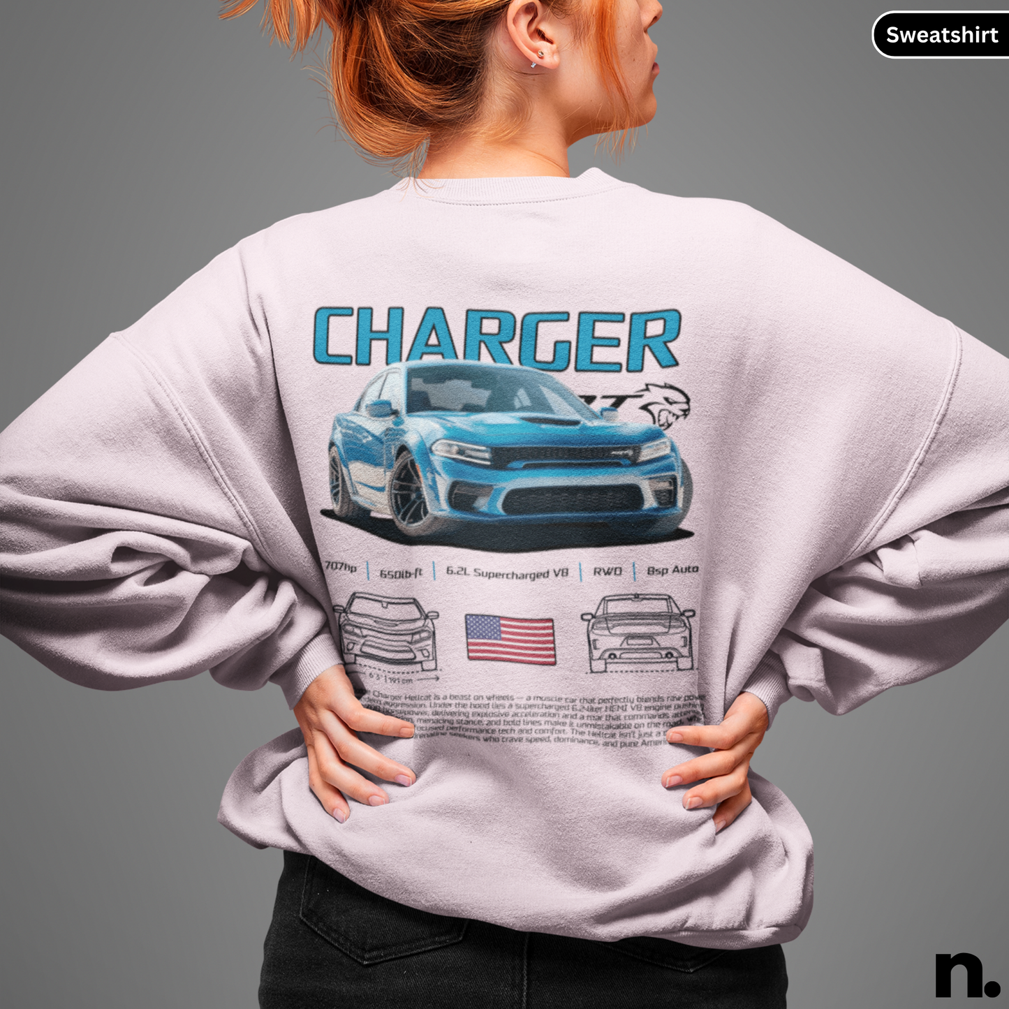 Person wearing a sweatshirt with a 'Charger' design on the back, featuring a blue car and American flag.