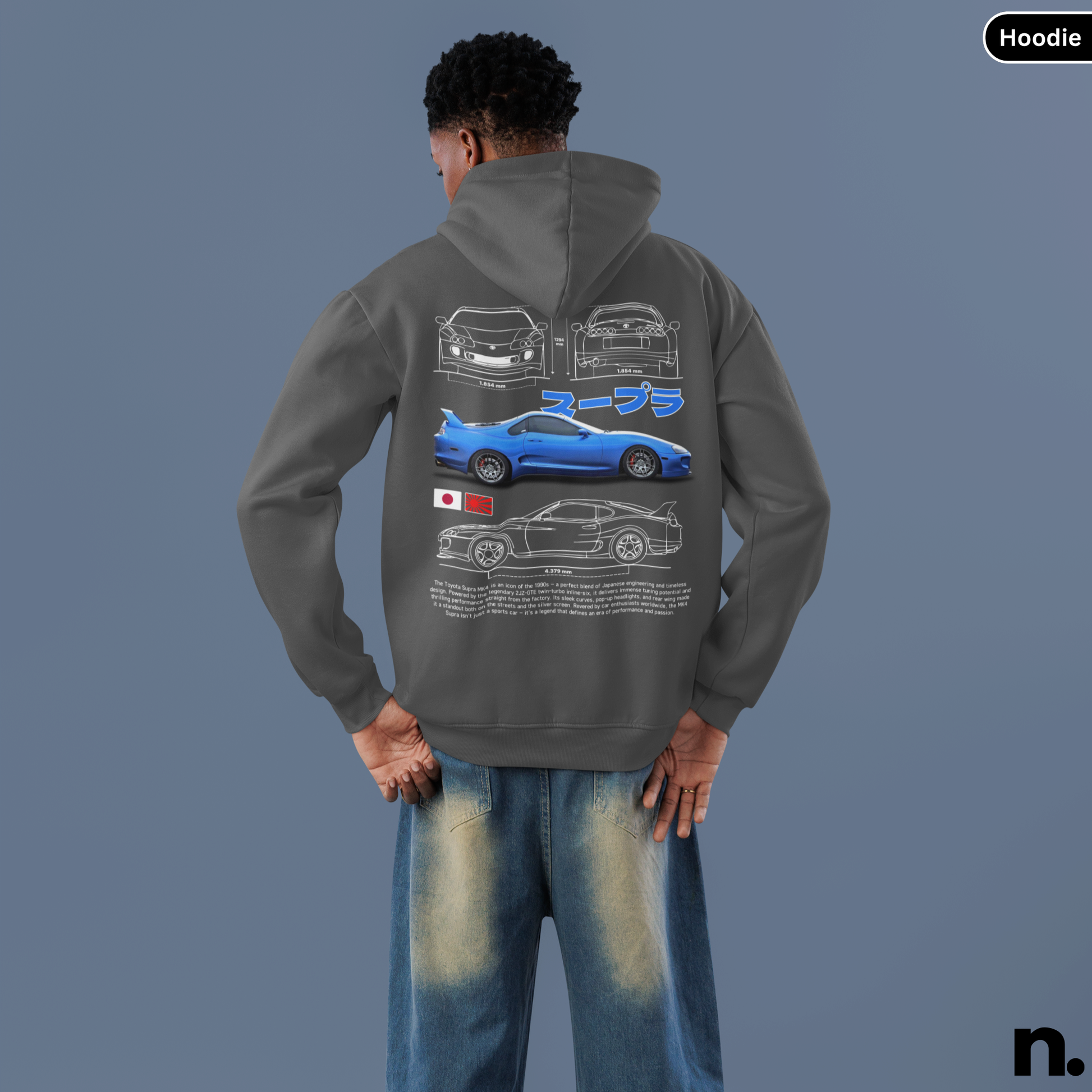 Person wearing a hoodie with car design on the back against a gray background