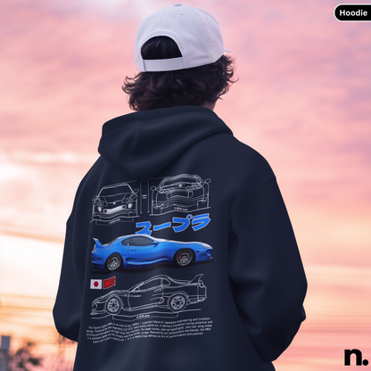 Person wearing a hoodie with car designs on the back against a sunset sky