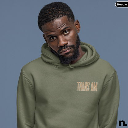 Man wearing a green hoodie with 'TRANS AM' text on a blue background
