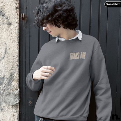 Person wearing a gray sweatshirt with 'THANK YOU' text, standing against a dark door.
