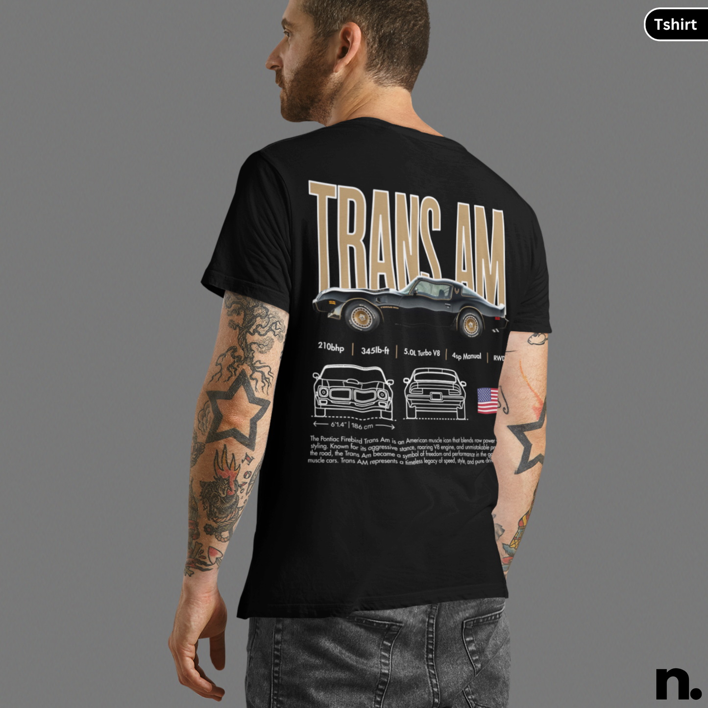 Black t-shirt with 'TRANS AM' design on the back, worn by a person with tattoos.