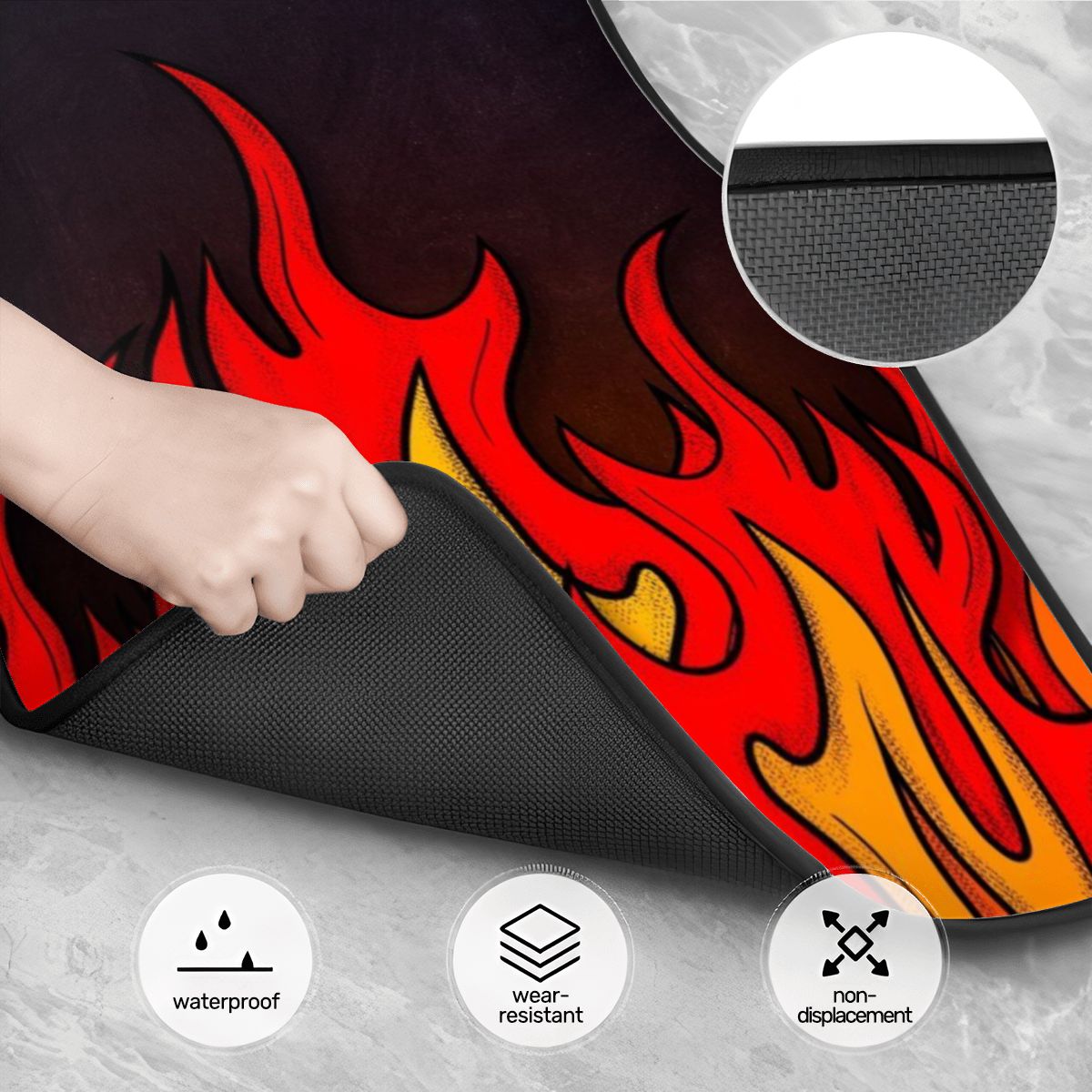 Flame-patterned mat with a hand holding it, showing waterproof, wear-resistant, and non-displacement features.