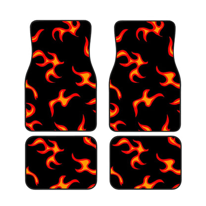 Set of four car floor mats with flame pattern on a black background