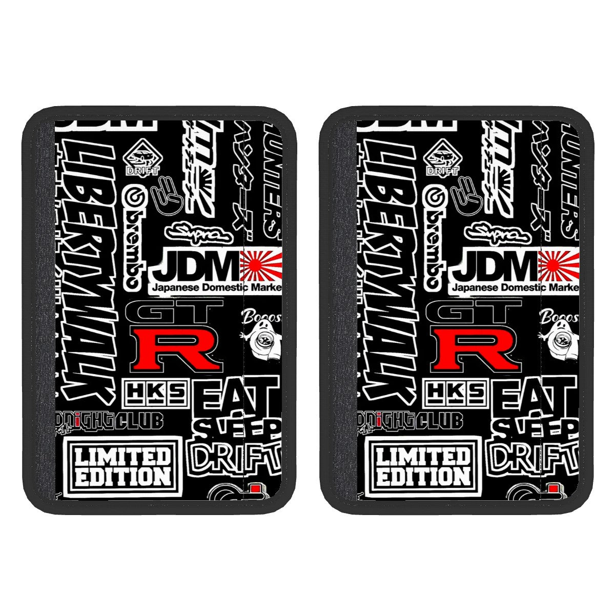 Two black neoprene seat belt cover pads with white text and graphics, including the terms 'JDM' and 'Limited Edition'. The pads are designed to be attached to a seat belt.
